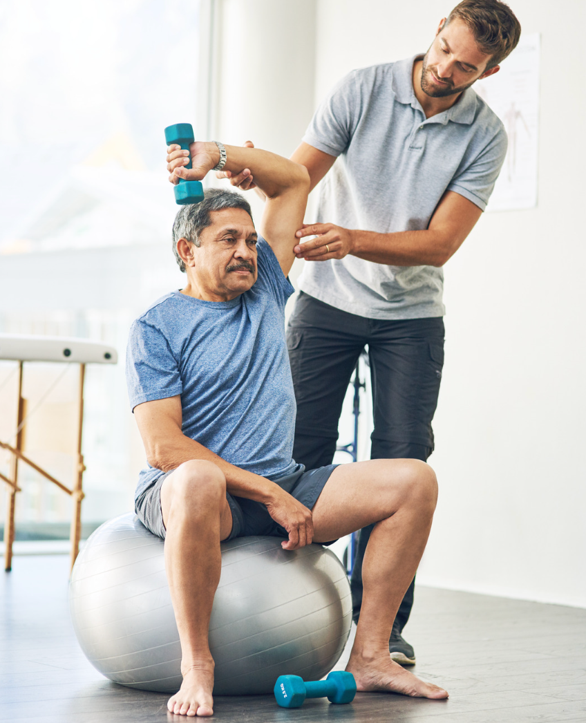 A clinician guiding a patient through supported exercise