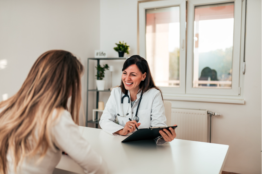 A specialist physician in consultation with a patient